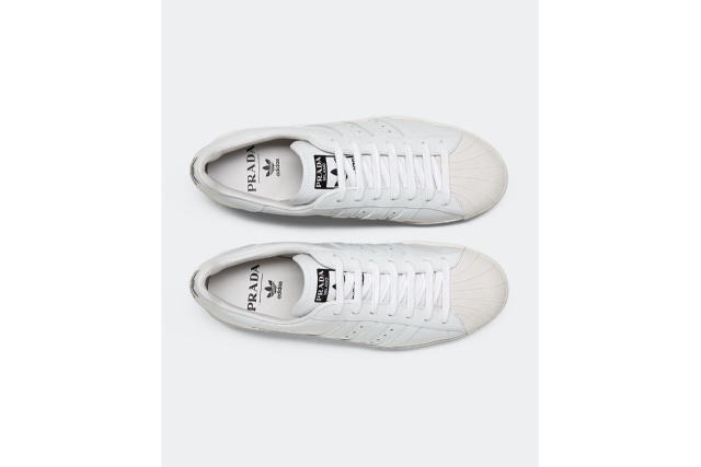 Top view of a pair of prada x adidas shoes