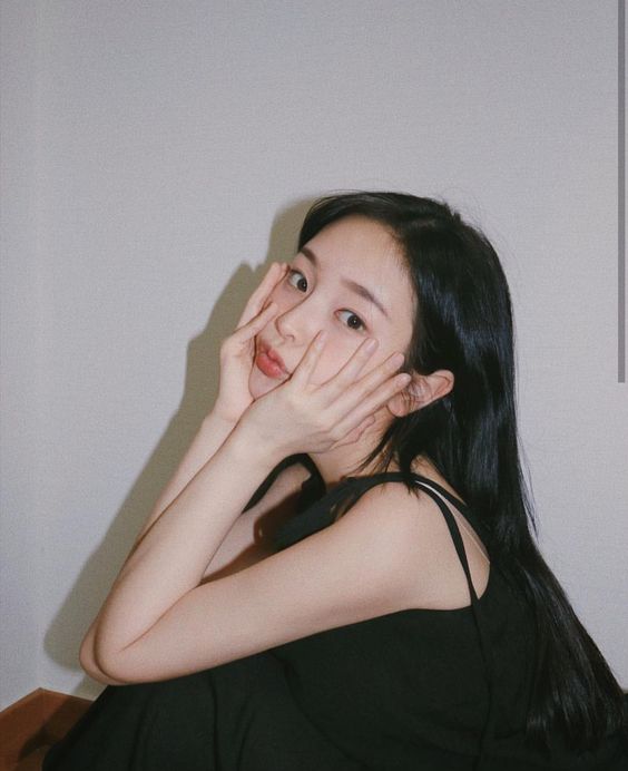 Girl with hands supporting her face