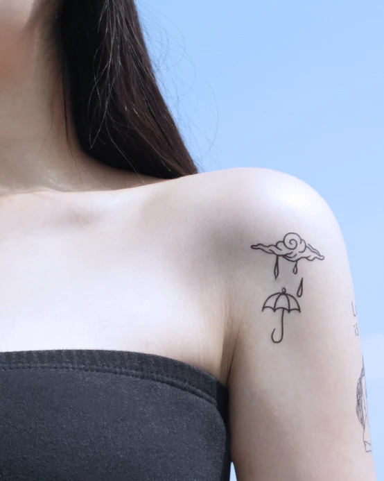 Cloud and umbrella tattoo