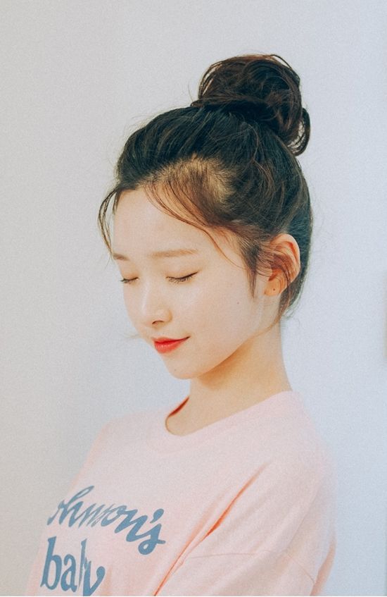 Girl with messy bun hair