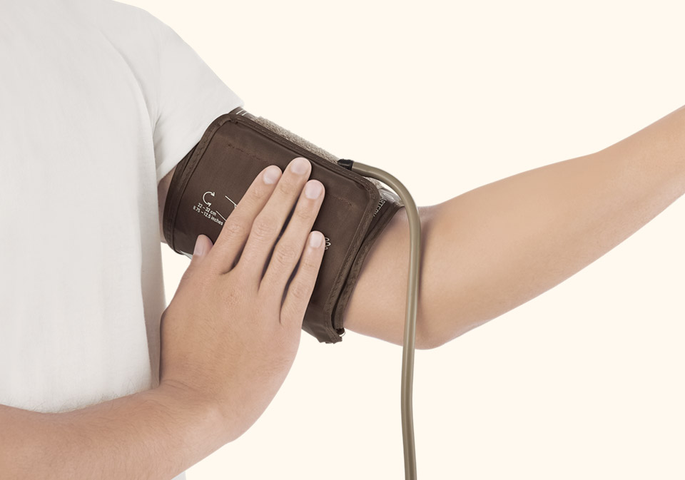 Guy testing his blood pressure