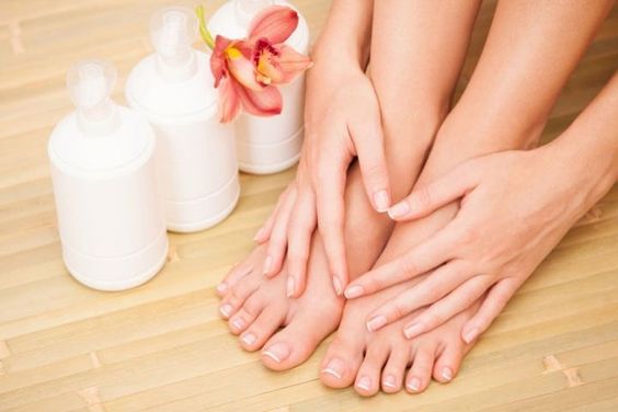 Manicured fingers and pedicured toenails