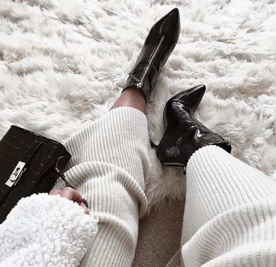 black boots on furry rug