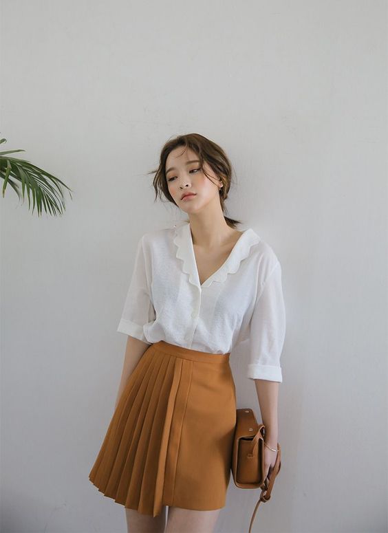 white blouse orange skirt
