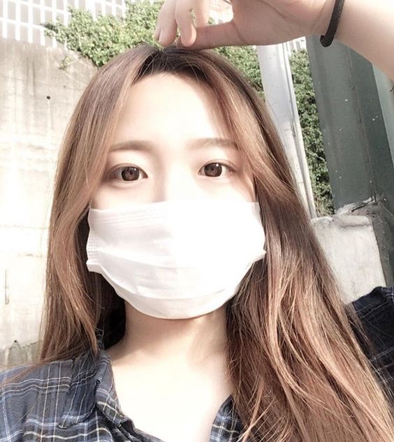 Girl wearing a white mask