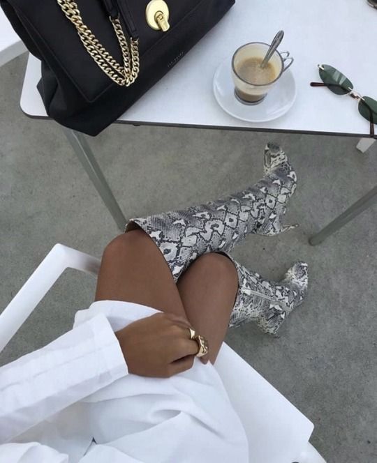 snakeskin boots in cafe