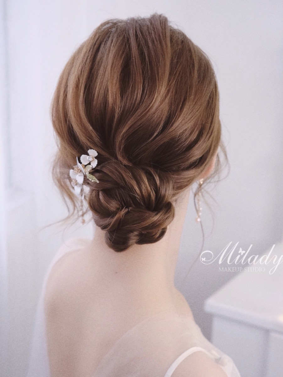 Low burly bun with hair accessory