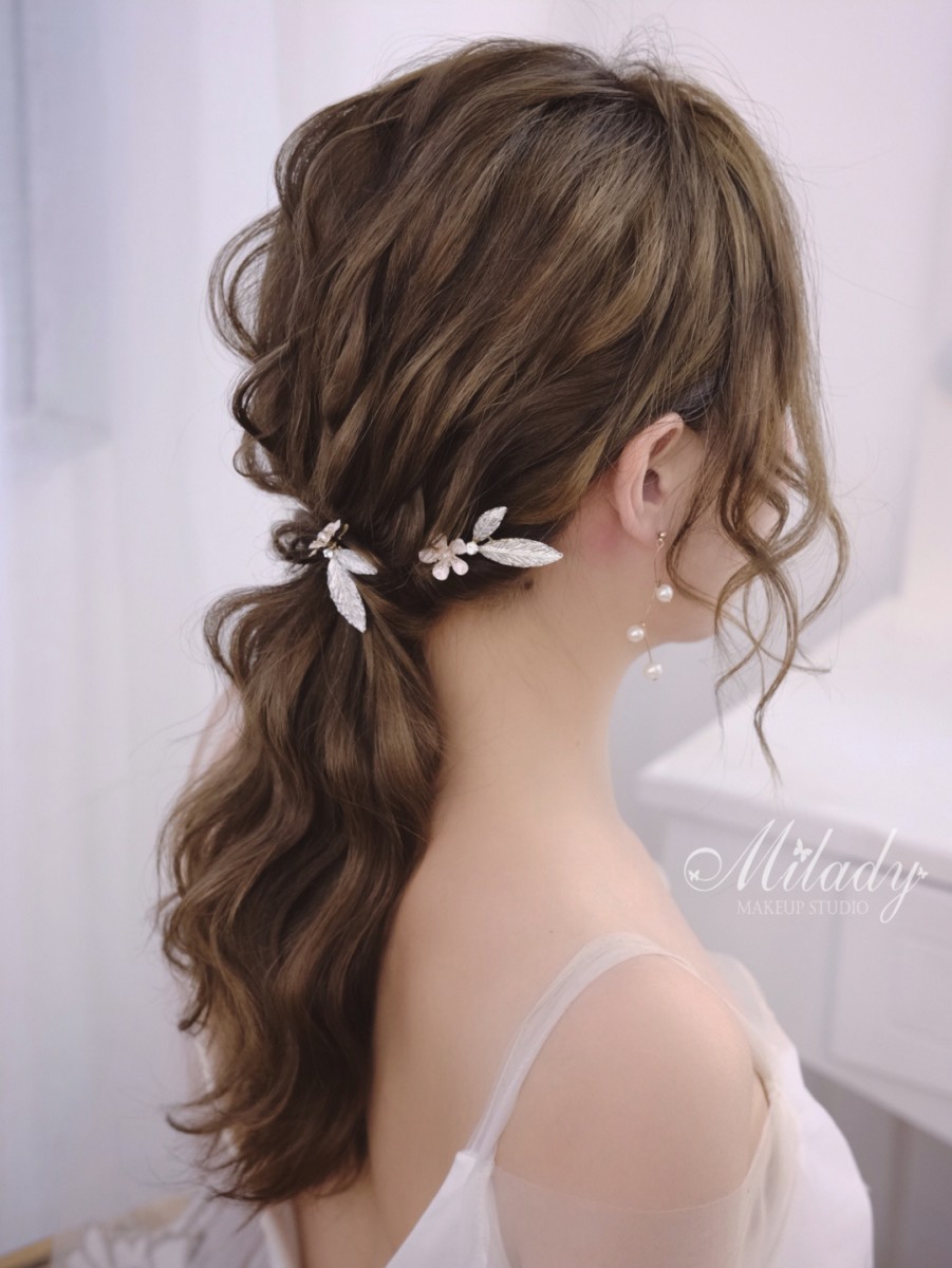 Long curly hairstyle with butterfly accessory