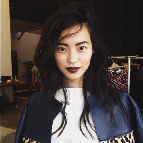 Asian woman wearing dark lipstick