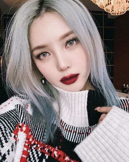 Asian woman wearing dark lipstick