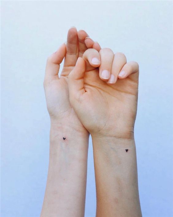 small tattoo on wrists