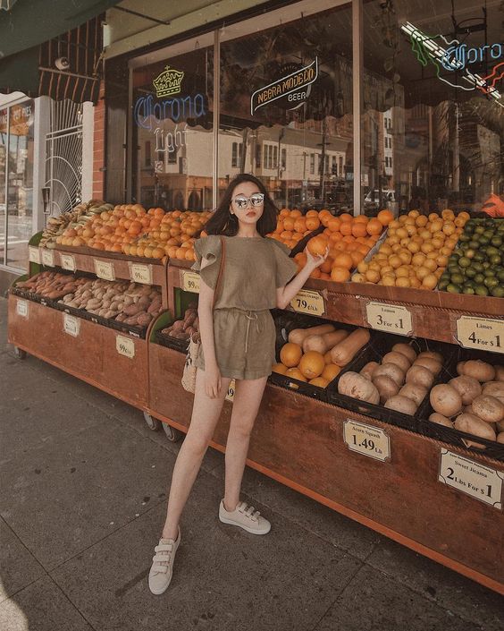 asian woman striking a flattering and slimming pose for photographs