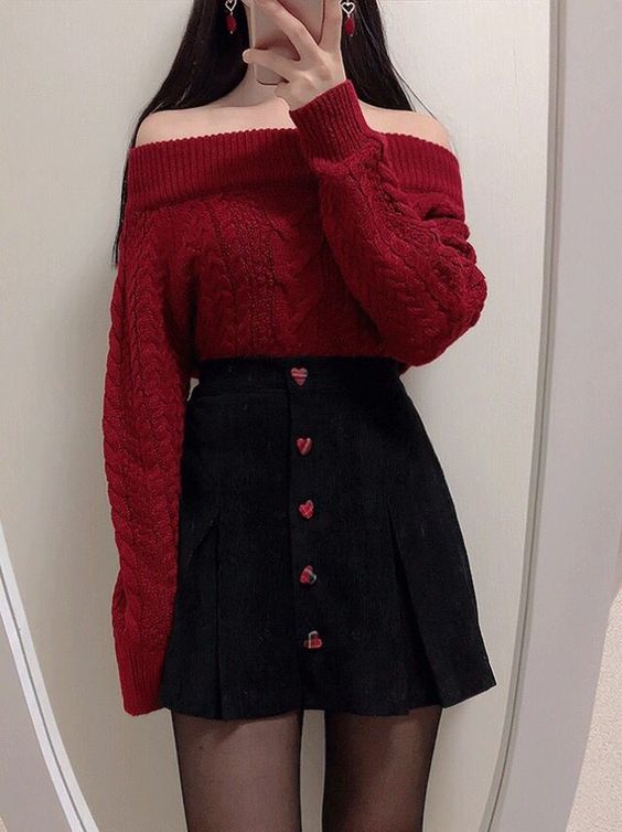 Red top tucked into skirt