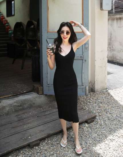 asian woman striking a flattering and slimming pose for photographs