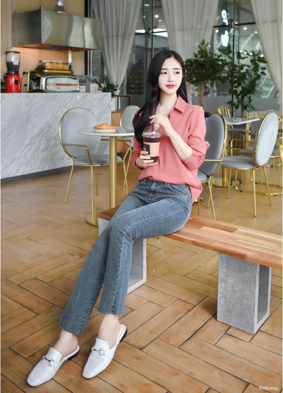 asian woman striking a flattering and slimming pose for photographs