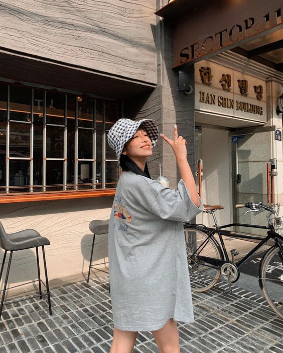 asian woman wearing a t-shirt dress