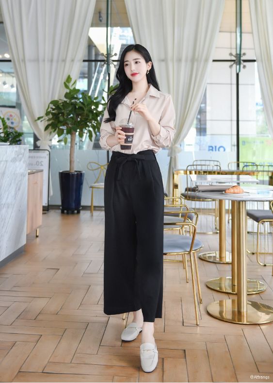 asian woman striking a flattering and slimming pose for photographs