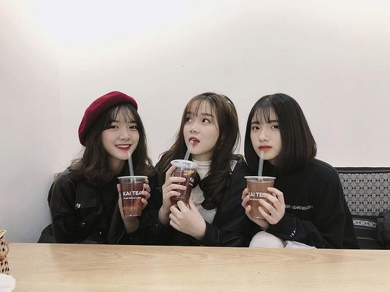 Three friends drinking coffee