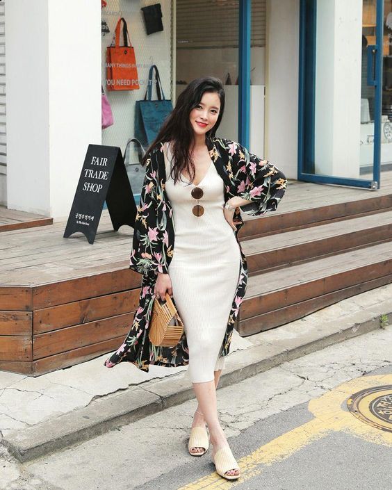 asian woman striking a flattering and slimming pose for photographs