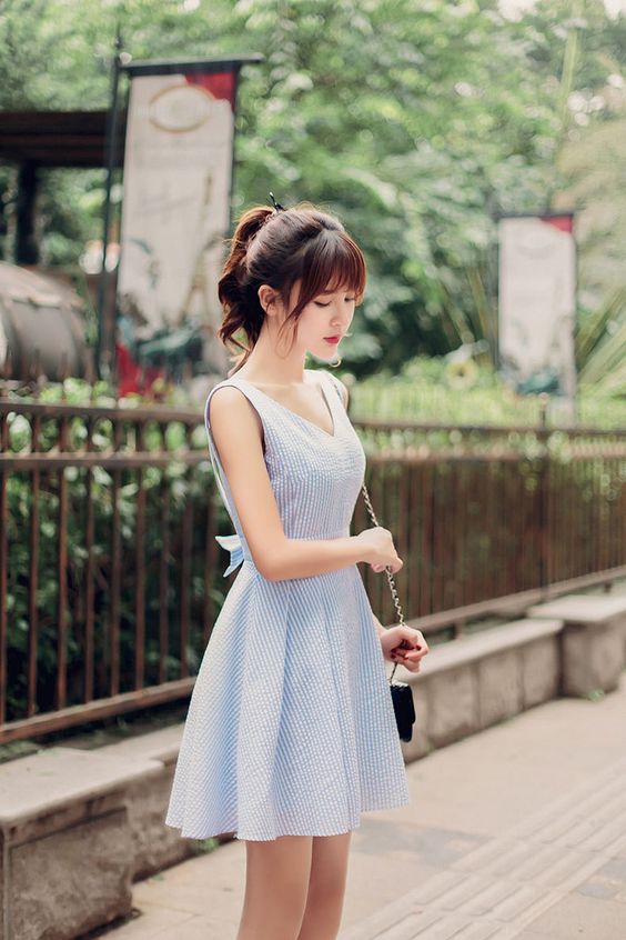asian woman wearing a dress