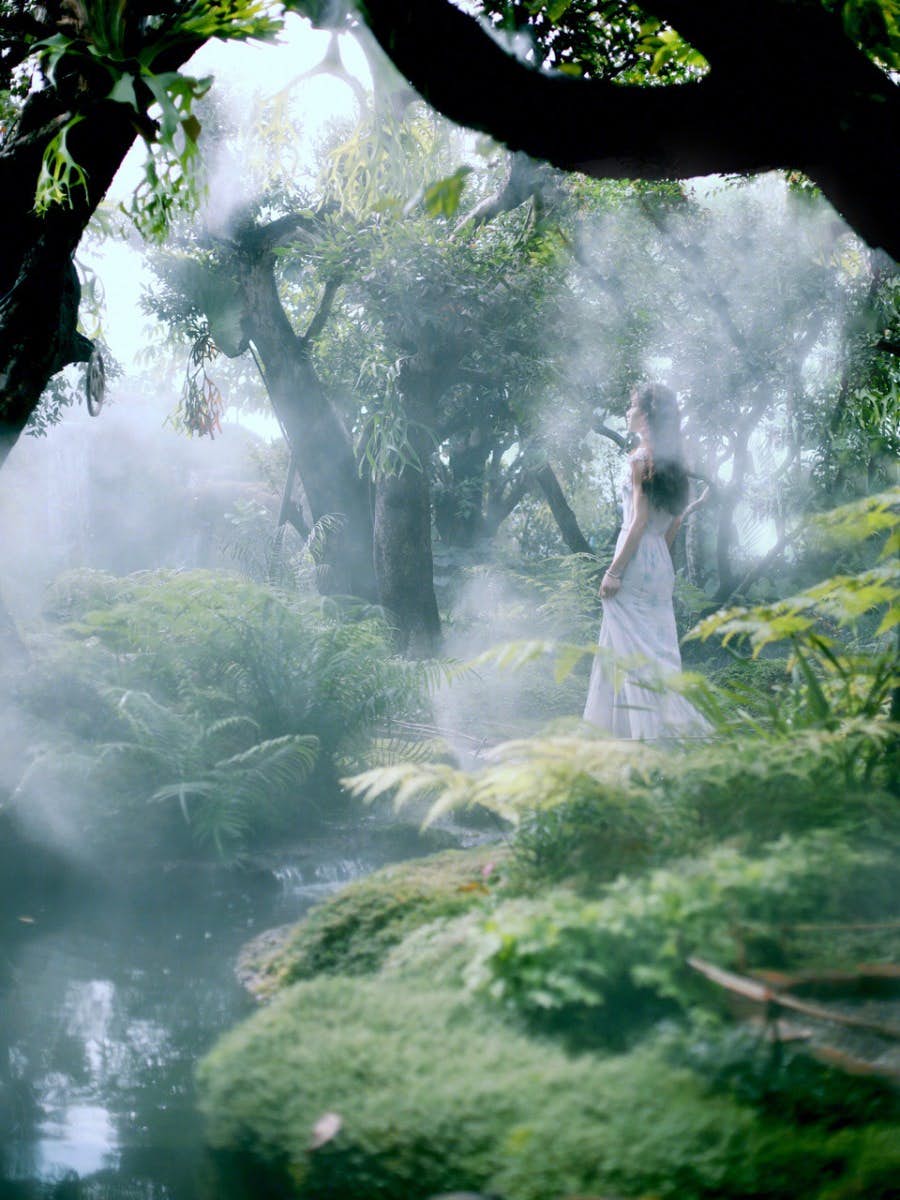 Girl standing in the forest