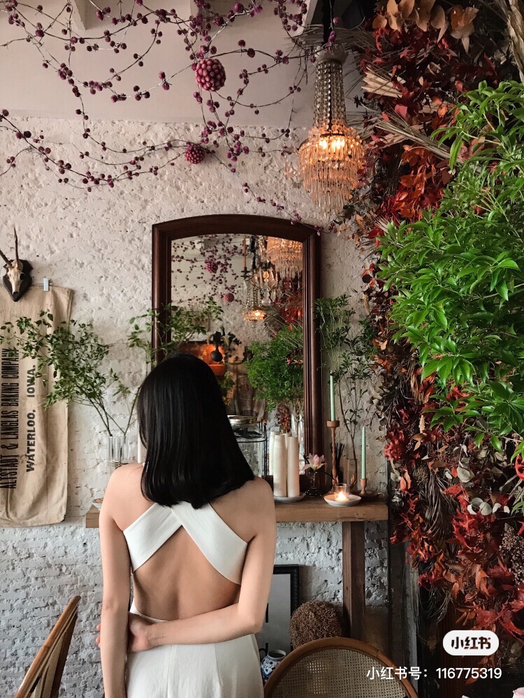 Girl posing in the floral cafe