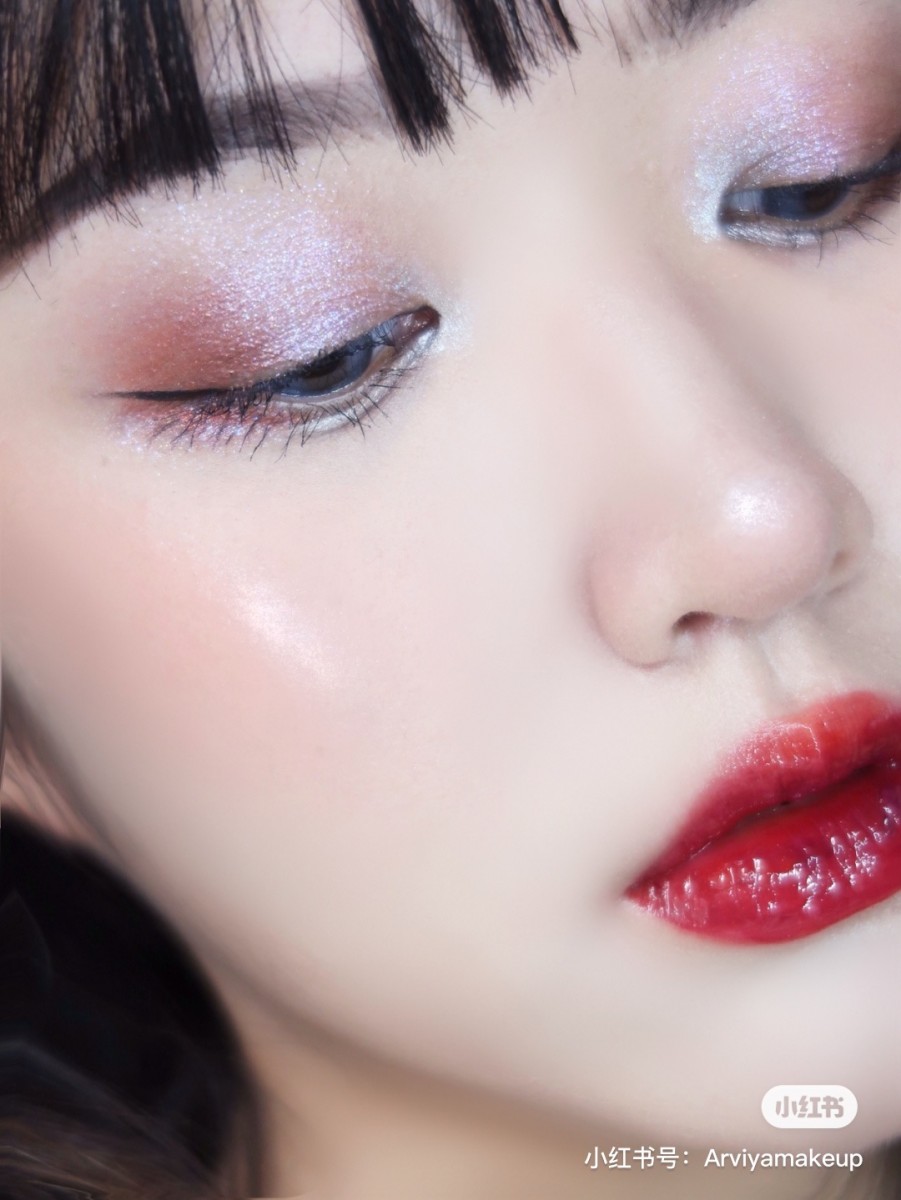 Close up on red glittery eye makeup look