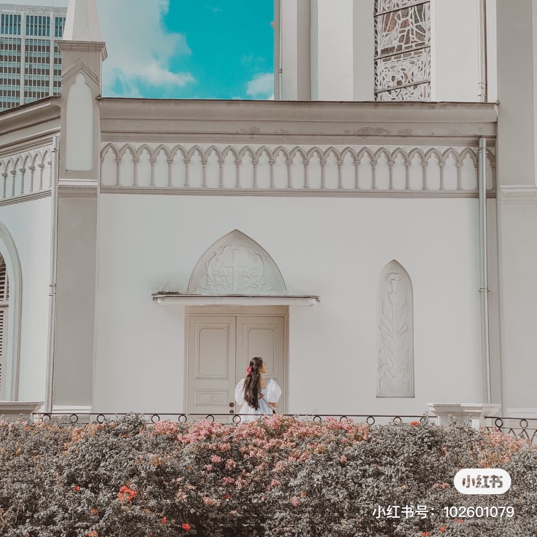Posing outside CHIJMES with bushes