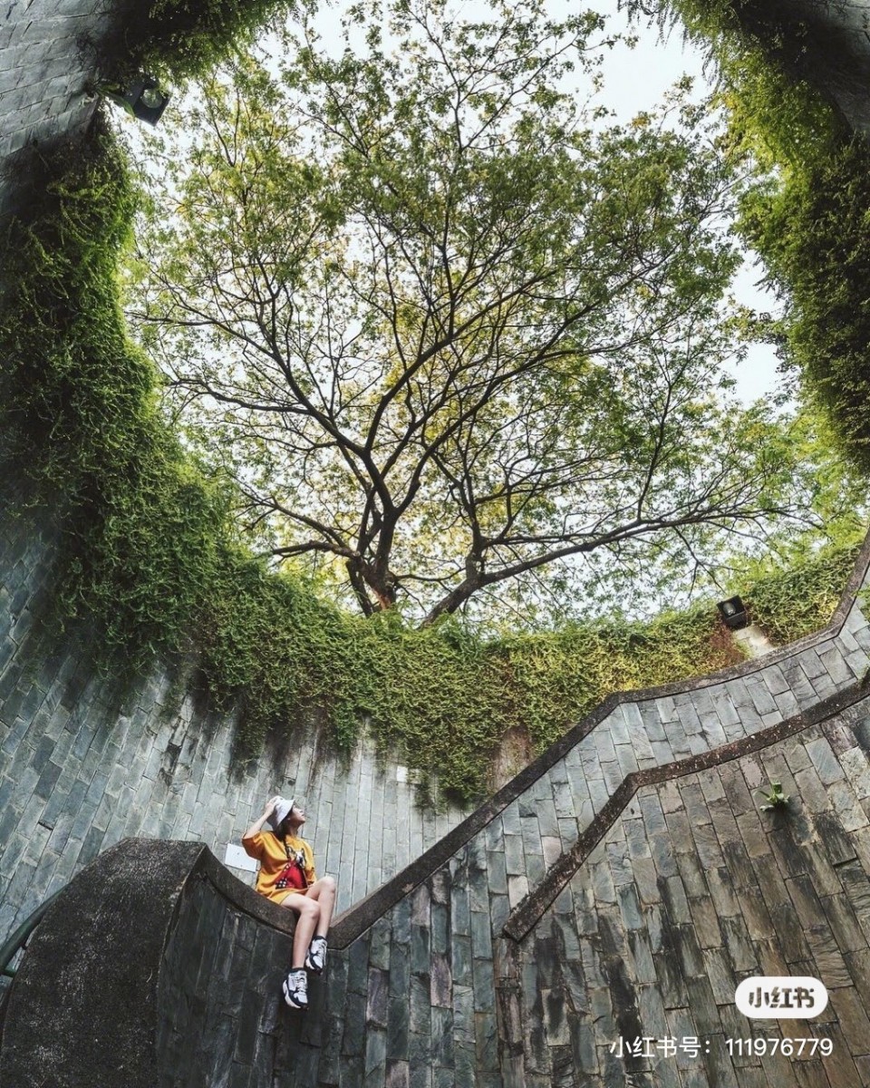 Girl sitting down in Fort Canning Park