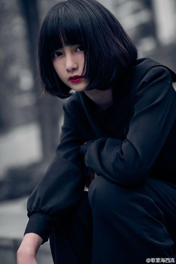 asian lady with short hair and bangs