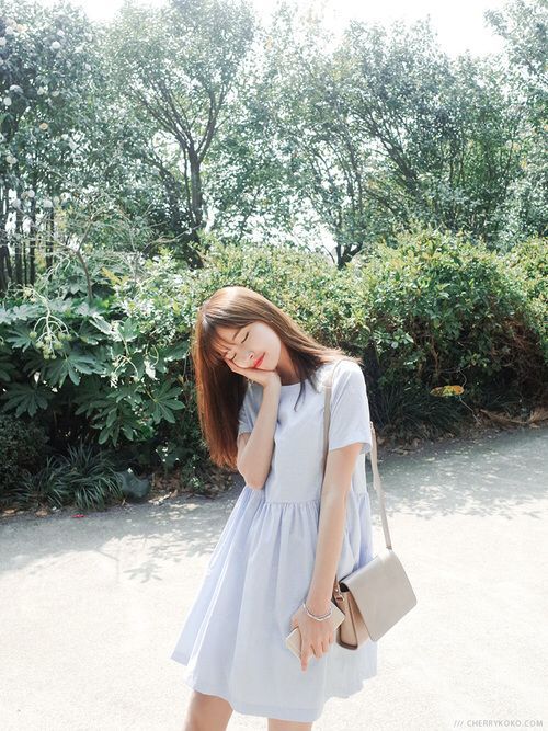 asian woman wearing a dress