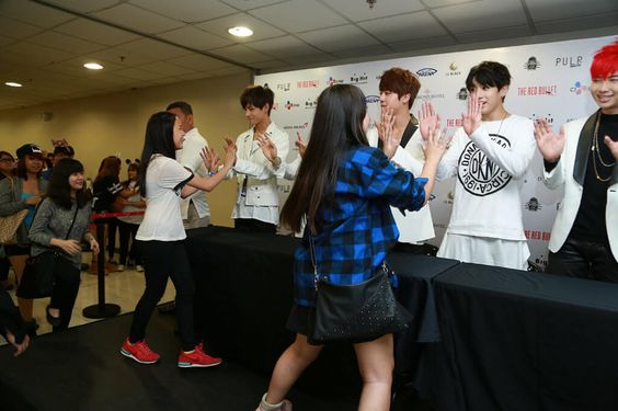 K-pop boy group at a hi-touch event