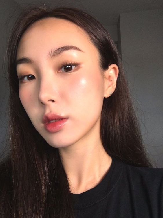 asian woman with glowy makeup