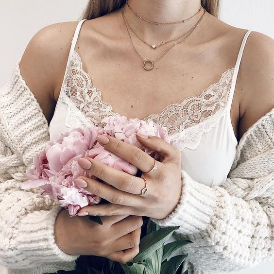 Layered necklaces with spaghetti strap top