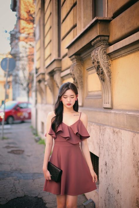 asian woman wearing a dress