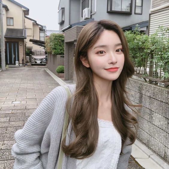 asian girl wearing a grey cardigan