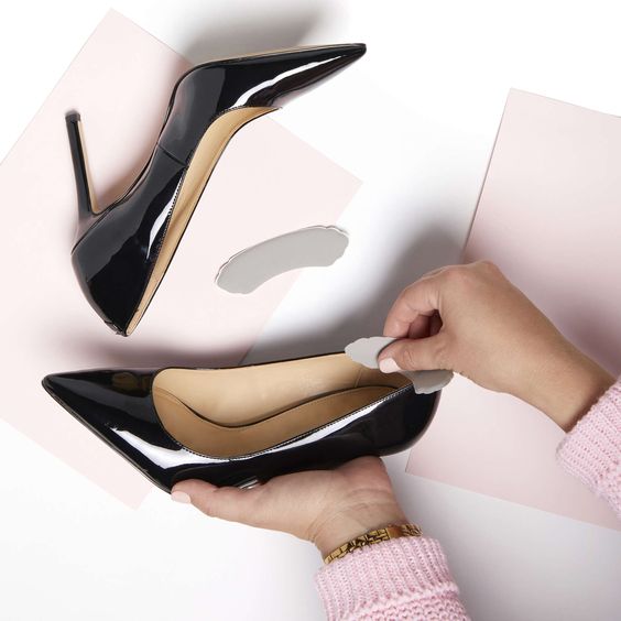 putting insert cushions inside black heels