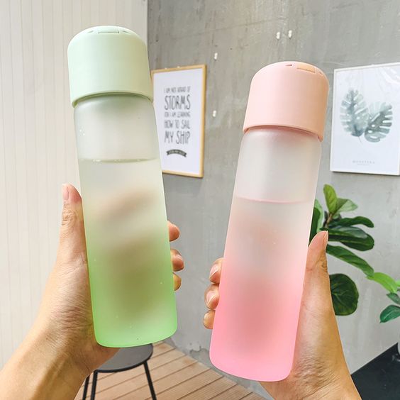 green and pink water bottles