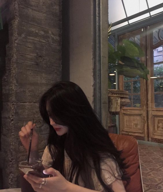 Girl drinking and using phone