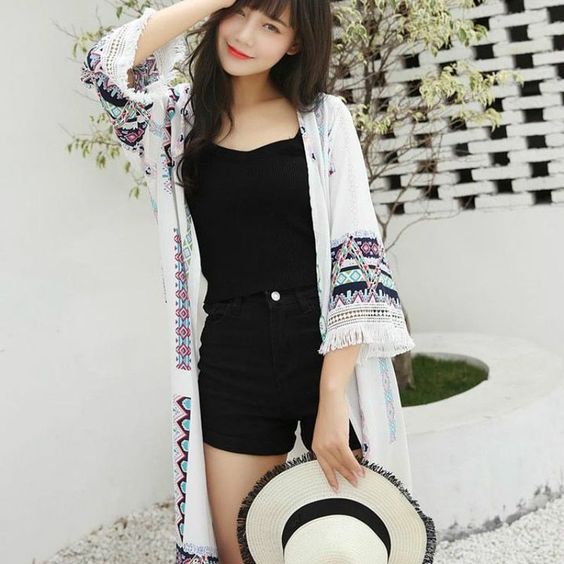 Asian woman wearing a kimono cardigan