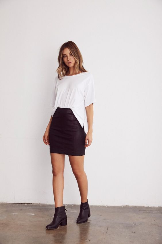 woman wearing white top and black skirt