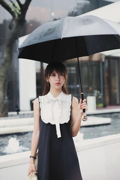 asian woman holding an umbrella