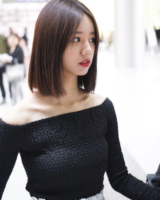 asian woman with a short blunt haircut