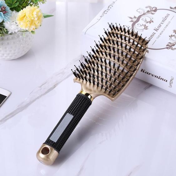 a natural bristle brush to get rid of frizzy hair