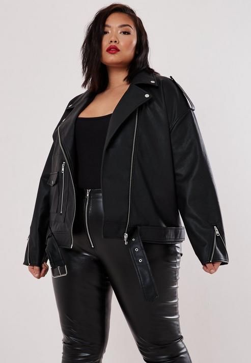 woman wearing leather jacket and dress