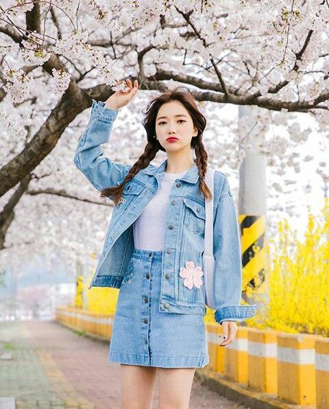 Asian woman wearing a denim jacket