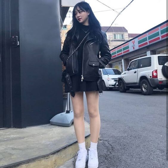 woman wearing leather jacket and jeans