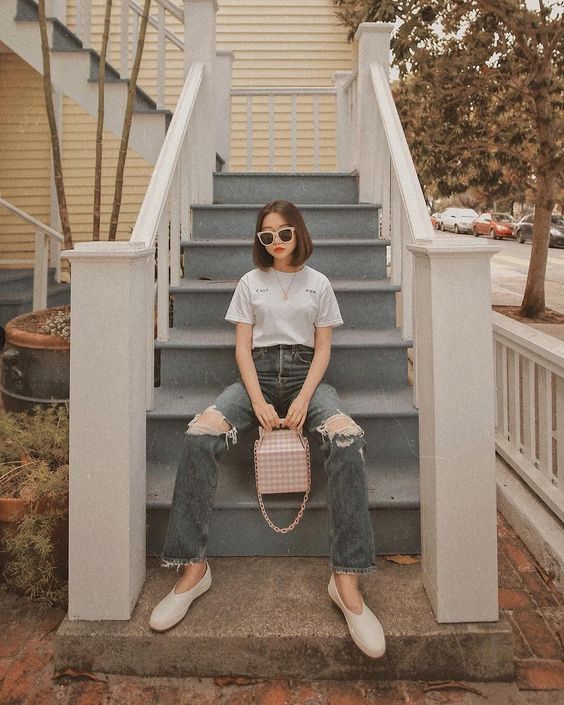 Asian woman wearing a t-shirt and jeans