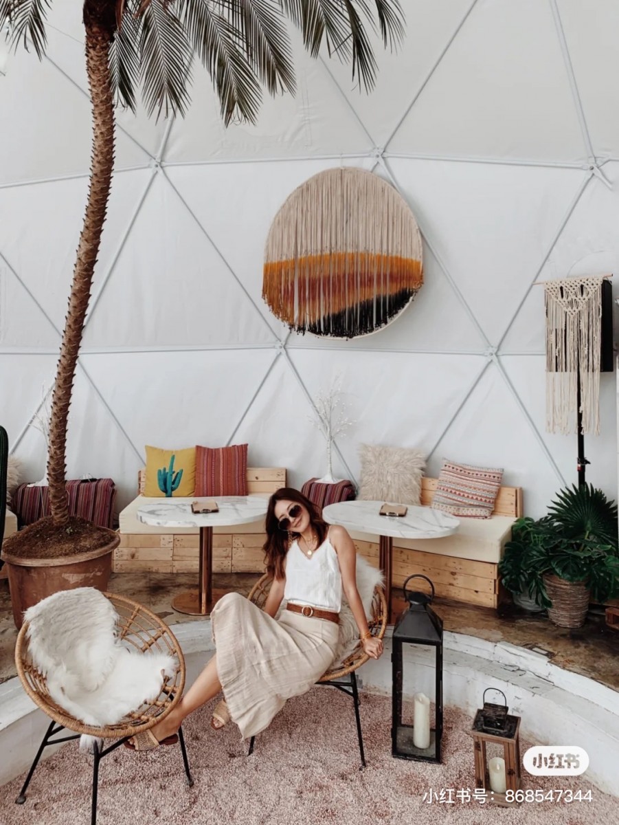 Girl sitting in the desert area in Drunk Cafe