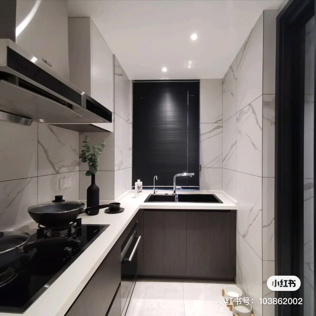 Small verticle kitchen with marble tiles